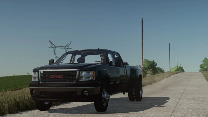 fs22-mods,  2010 GMC 3500HD truck mod in Farming Simulator 22, updated v1.0.0.0, driving on a rural road. FS22 mods.