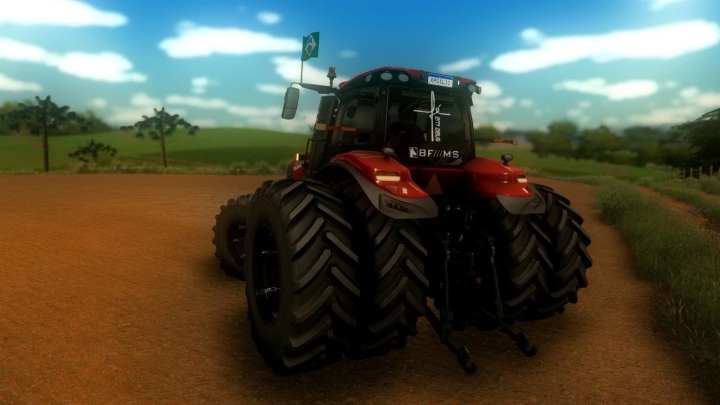 Rückansicht des Case IH Magnum AFS Connect Traktor-Mods in FS22 mit brasilianischer Flagge und Dreifachrädern auf Ackerland.