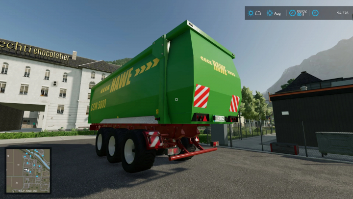 Mod FS22 rimorchio Hawe CSW 5000 in Farming Simulator 22, con design verde e grafica dettagliata.