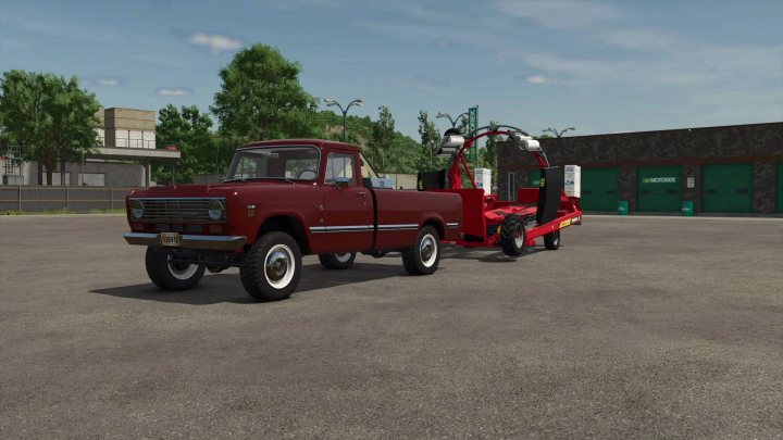 fs25-mods,  FS25 mod International 200 Series Pickup with additional attachers parked in front of a garage.