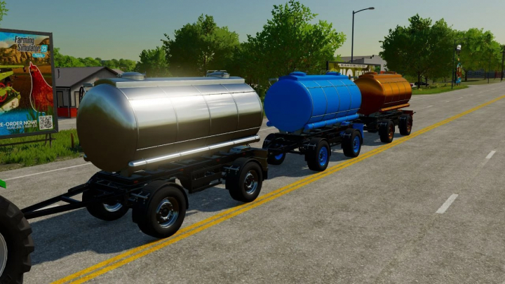 Lizard Tanker-Mod für FS22 mit drei bunten Tankanhängern auf einer Straße.