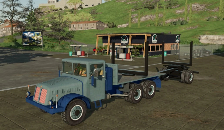 fs22-mods,  Old blue Praga truck mod in Farming Simulator 22 near a gas station.