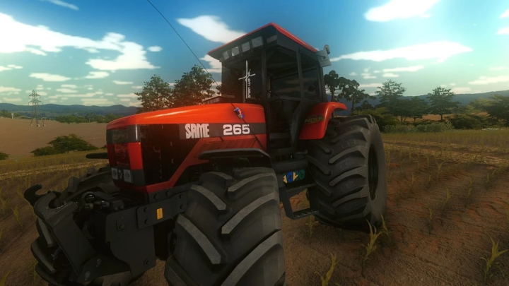 Mod de tractor SAME 265 BR para FS22 con diseño rojo en un campo bajo un cielo azul.