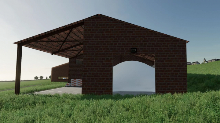 FS22 Mod: Ziegel-Lagerhalle für Straßenwartung in Farming Simulator 22, mit offenem Design und ländlicher Umgebung.