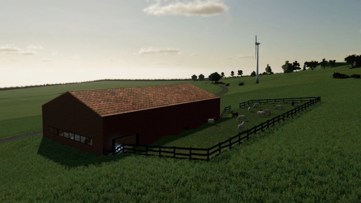 Sheepfold surrounded by green fields in FS22 mods, showcasing a barn and sheep under an open sky.