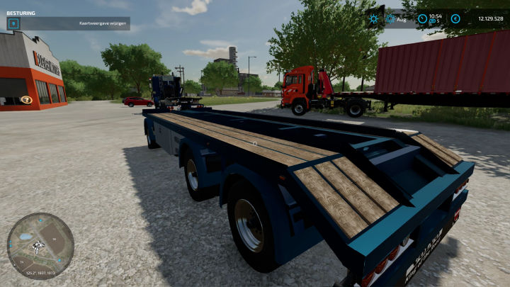 FS22-mod Volvo F12-chassis met container op parkeerplaats. Farming Simulator 22 mods verbeteren de gameplay.