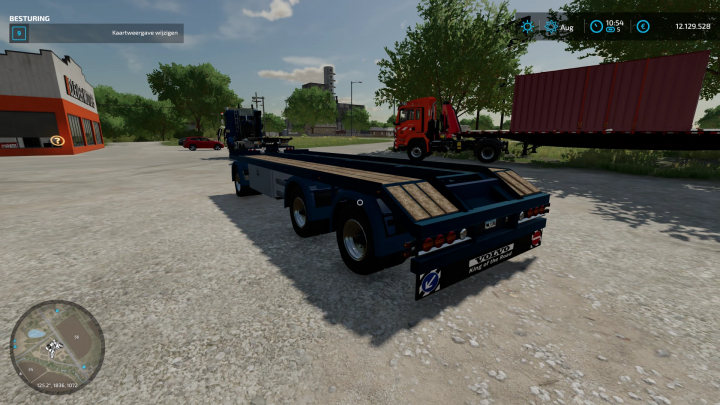 FS22-mod toont de Volvo F12 met 20ft DTEC-chassis geparkeerd op een virtueel terrein in Farming Simulator 22.