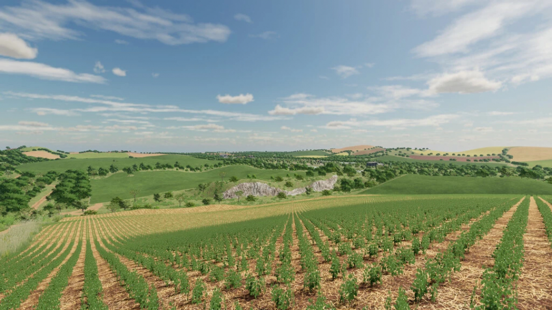 Vista panoramica di Canarinho Farm nel mod FS22, con vasti campi verdi sotto un cielo azzurro. Ideale per le mod di Farming Simulator 22.