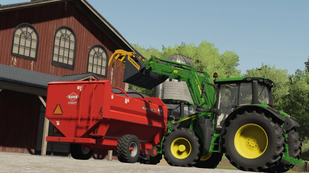 FS22 mod John Deere 6M Series v1.0.0.0 with loader in action with red trailer beside barn.