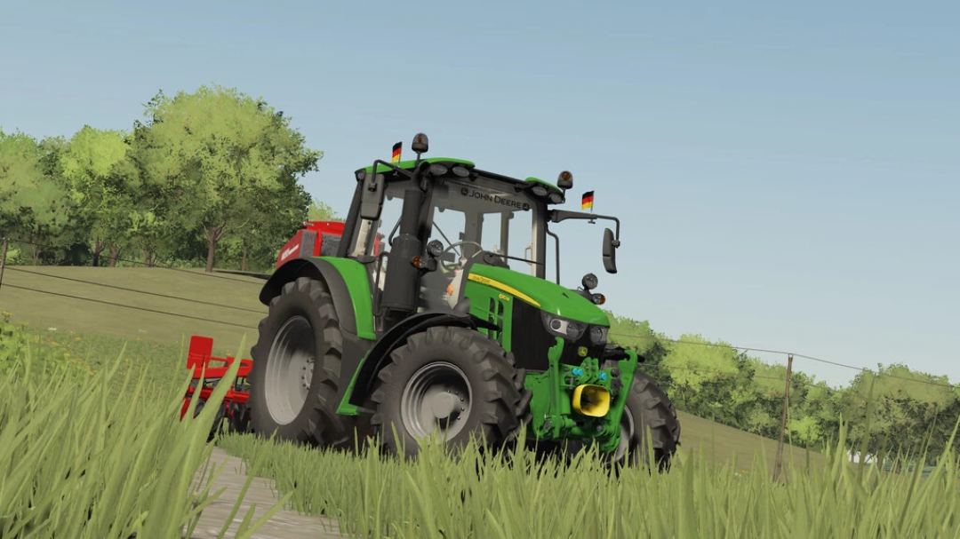 FS22 mod of John Deere 6M Series tractor on grassy field, Farming Simulator 22