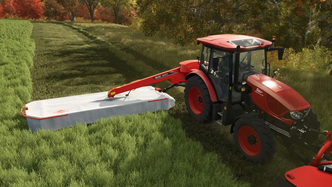 FS25 mod Kuhn GMD 4411 attached to a red tractor mowing grass in Farming Simulator 25.