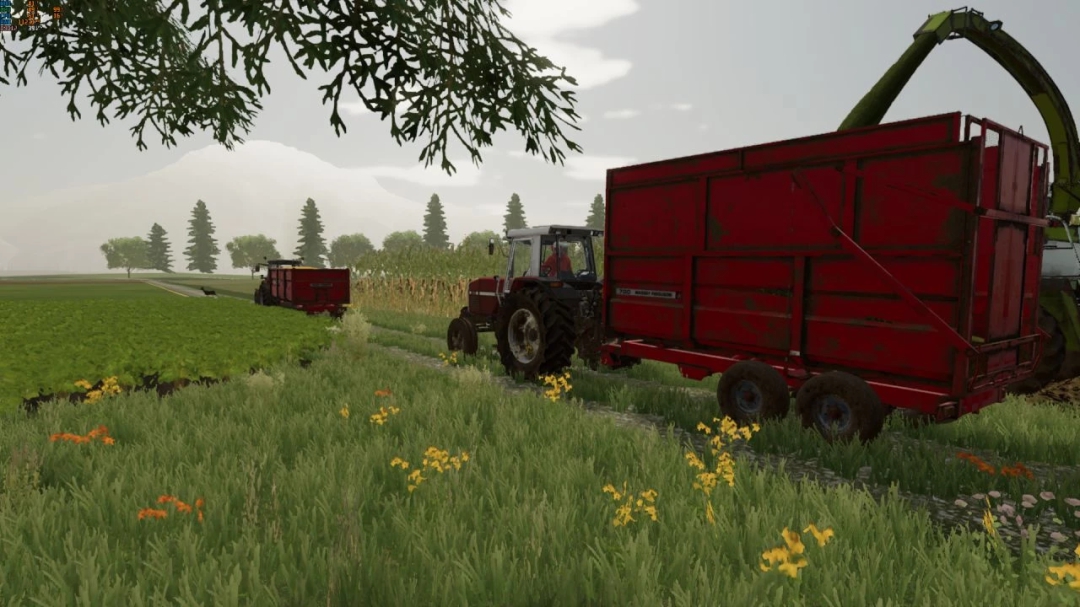 Mod FS22 Massey Ferguson 700, tractor con remolque rojo en paisaje de granja exuberante.