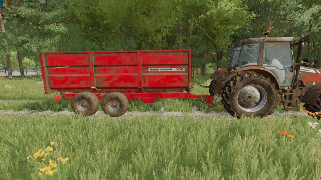 Mod FS22 remolque Massey Ferguson 700 enganchado a un tractor en campo de hierba.