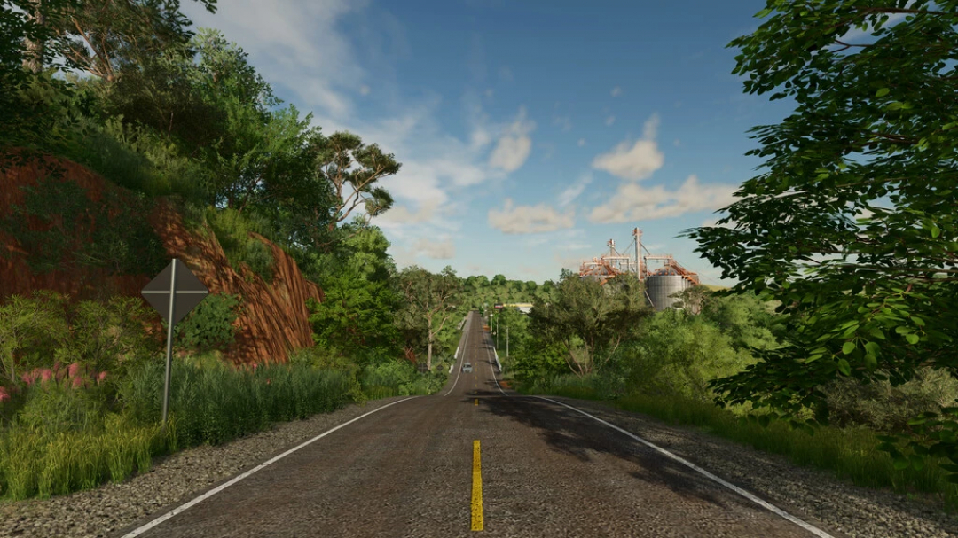 Malerische Straße mit üppiger Vegetation im FS22 Matopiba Map-Mod, die detailliertes Landschaftsdesign zeigt.