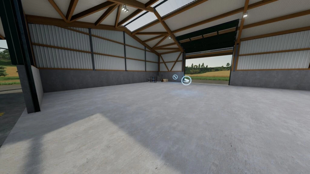 Spacious interior of Multi-fruit Farm Storage mod in FS22, showcasing a large, empty storage space with open doors and a view of the countryside.