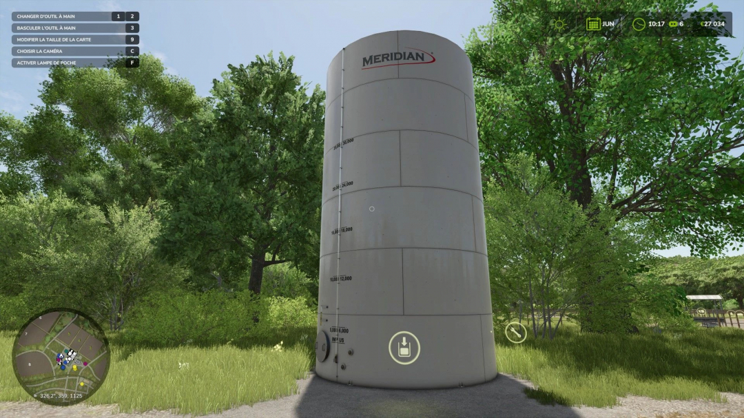 FS25 mod Silo Multifruits v1.0.0.0 featuring a large cylindrical silo by Meridian in a lush green environment.