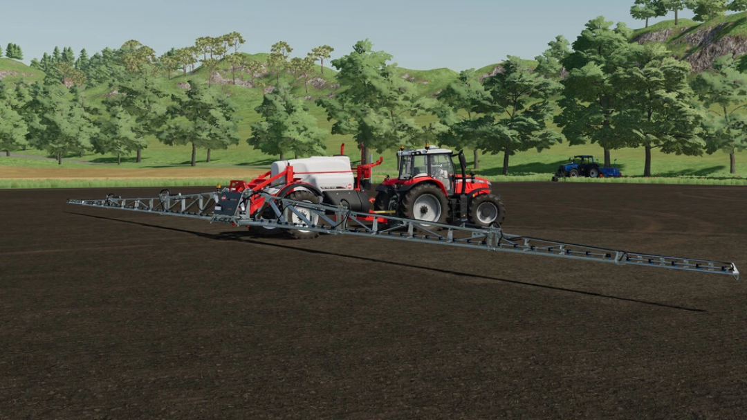 FS22 mod Sprayer KUHN METRIS 4102 v1.0.0.0 in a field, showcasing extended booms attached to a red tractor in Farming Simulator 22.