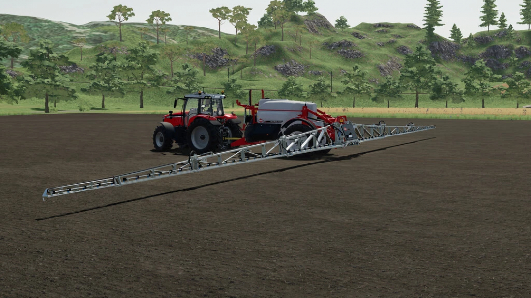 FS22 mod Sprayer KUHN METRIS 4102 attached to tractor on a field in Farming Simulator 22.