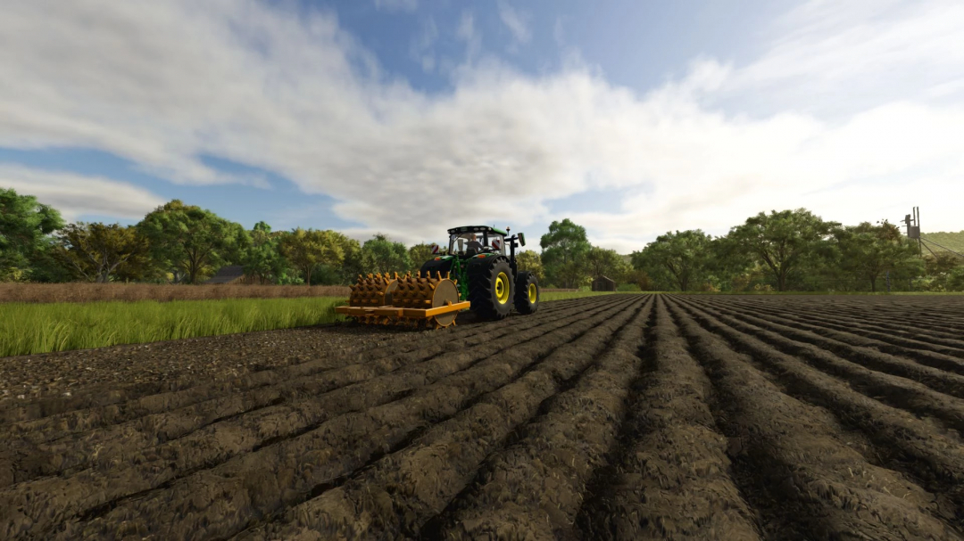 Tractor with Wedge's Foot Roller mod in FS25 on a plowed field