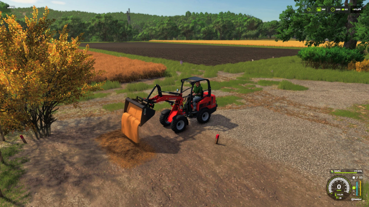 fs25-mods,  FS25 mod scene with small red loader lifting manure near farmland in Farming Simulator 25.