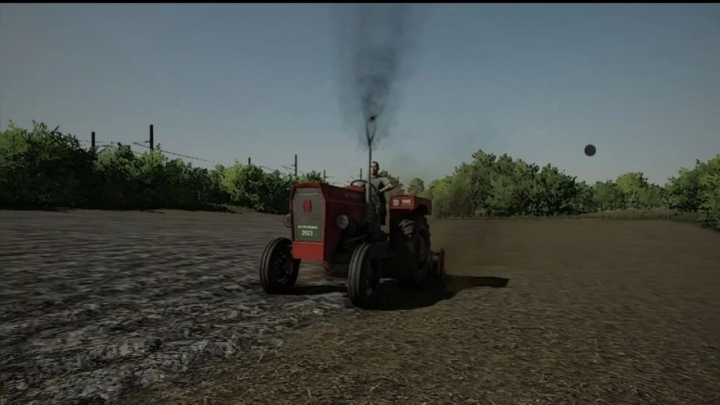 fs22-mods,  IMT 540 tractor mod in FS22, showing smoke from exhaust on a field.