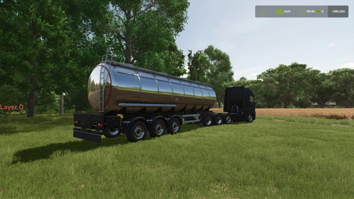 fs25-mods,  FS25 Mks32 Tanker Trailer Edit v1.0.0.0 in a field setting, showcasing a shiny silver tanker attached to a black truck in Farming Simulator 25.