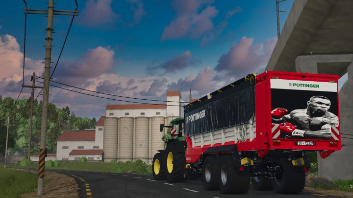 fs25-mods,  Poettinger Jumbo 8450DB Iron Mike Edition mod in FS25, featuring a detailed farm setting with silos.