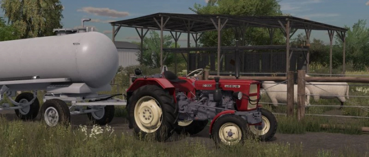 fs22-mods, FS22 mod Ursus c330/328 tractor next to a trailer in a farm setting with a shed and sheep in Farming Simulator 22.