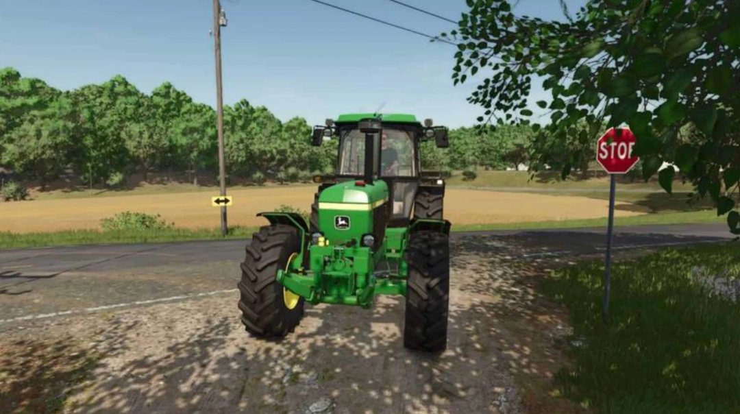 Mod FS25 Auto Turn Signal Off v1.0.0.0 con un tractor verde cerca de una señal de stop en un entorno rural.