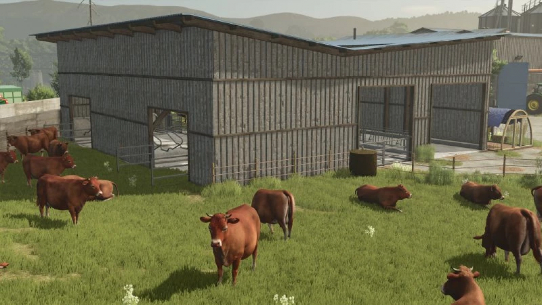 Barn with pasture mod in FS25, showing cows grazing in a field beside a wooden barn structure.