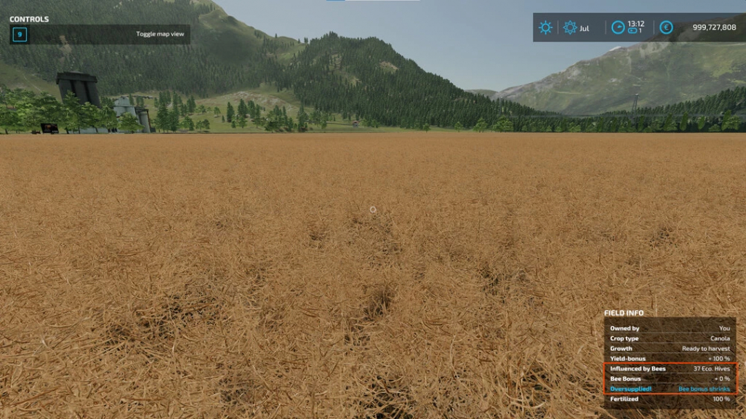 FS22 mod Bees Revamp v1.1.0.1 showing a canola field ready for harvest, influenced by bees, in Farming Simulator 22.