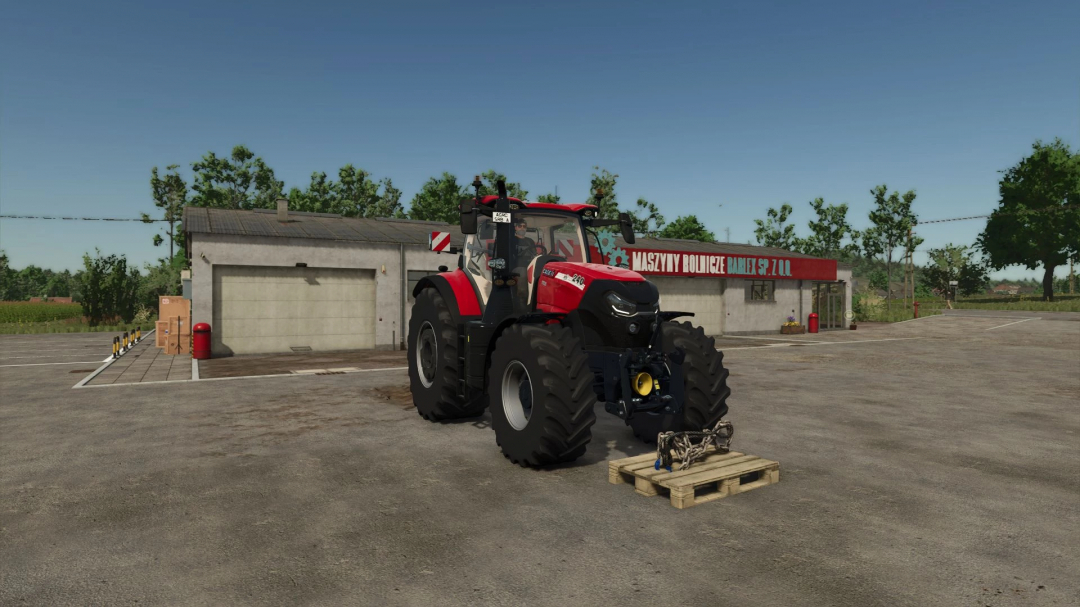 FS25 mod Chains and Cables v1.0.0.0: Tractor parked near a building with chains on a pallet, enhancing gameplay realism.