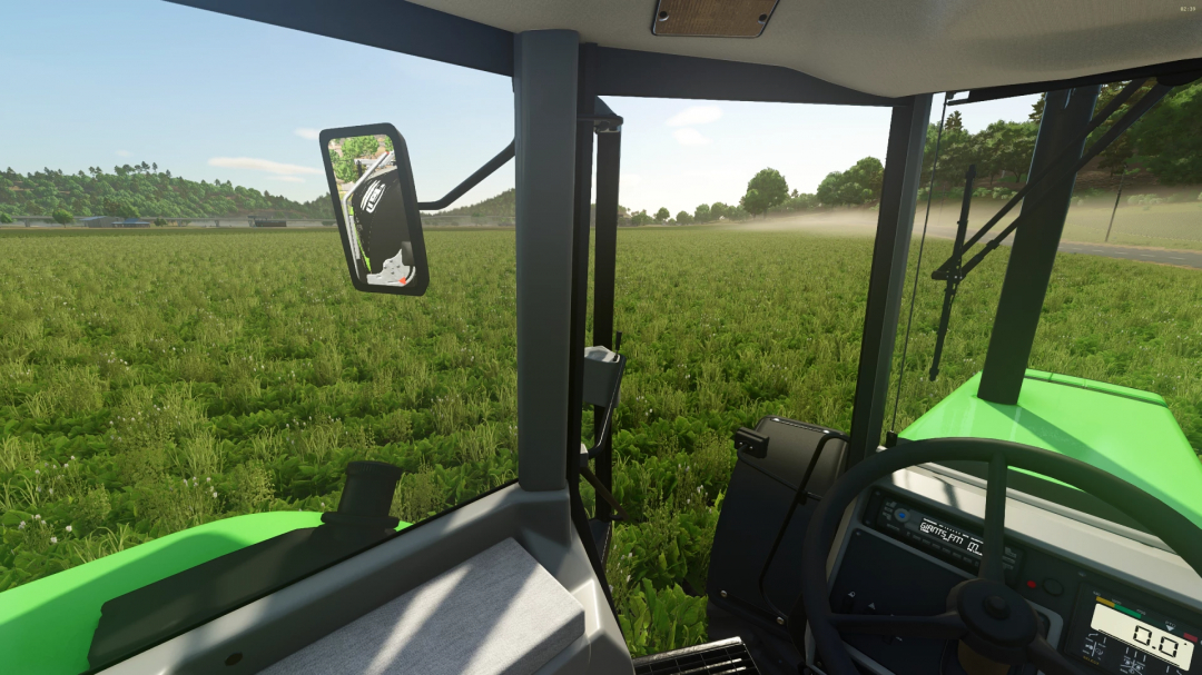 View from inside the Deutz AgroStar 8.31 tractor in FS25 mod, showcasing animated door feature in a vast green field.