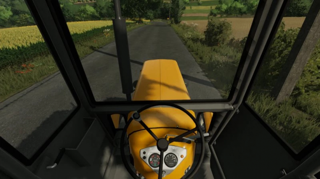 Interior view of FS22 Ursus C360 tractor mod on a country road in Farming Simulator 22.