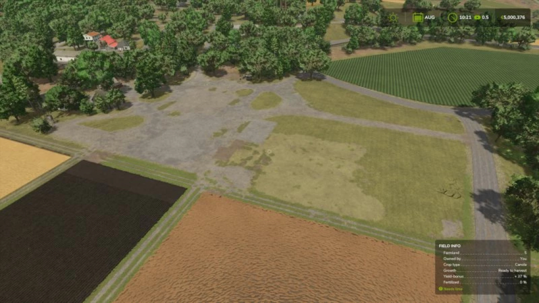 FS25 Empty farm lot Riverbend Springs mod shows a large cleared field surrounded by trees, with nearby cultivated land, in Farming Simulator 25.