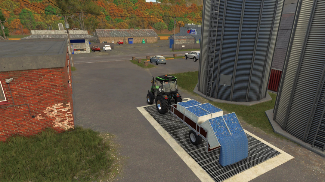 FS25 Vine Hand Harvest Trailer mod with tractor unloading grapes at silo, Farming Simulator 25.