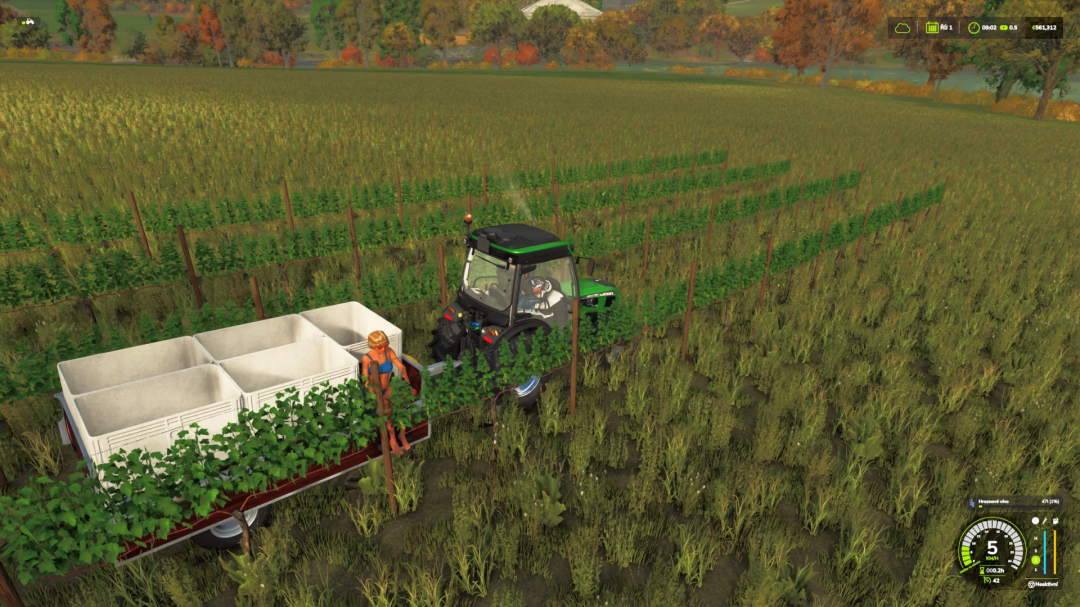 FS25_VineHandHarvestTrailer mod in Farming Simulator 25 with a tractor in a vineyard.