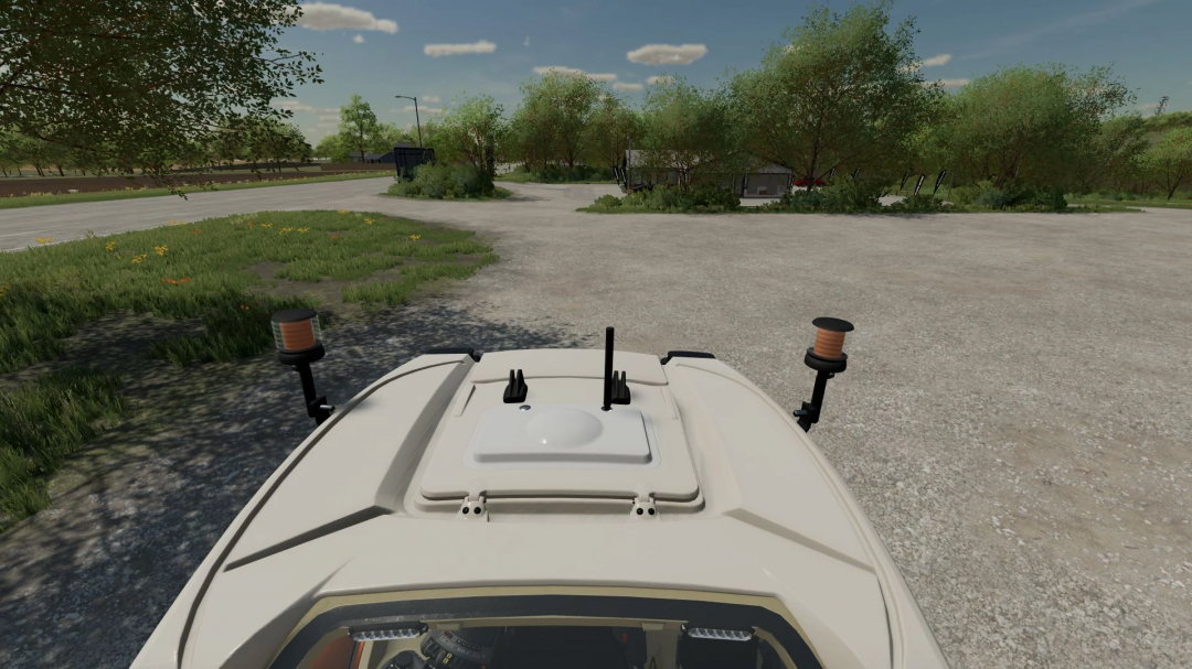 FS22 mod Fendt Vario 700 Municipal v1.2.0.0 showing vehicle rooftop view with antennas in a rural scenery.