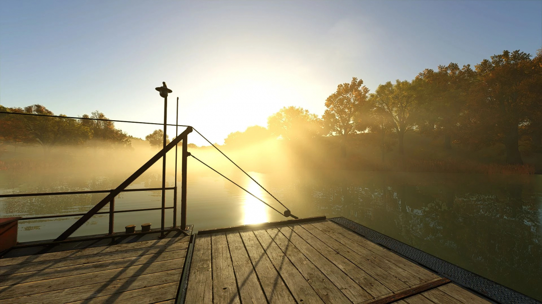 Serene sunrise view enhanced by First Reshade mod in Farming Simulator 25, highlighting a misty landscape over a calm river.