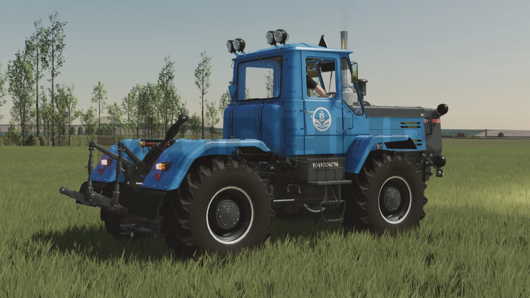 HTZ T-150K-09 tractor mod for FS22, blue color, displayed in a grassy field.