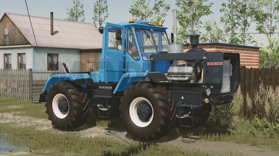 HTZ T-150K-09 tractor mod for FS22, parked in a rural setting with a house in the background.