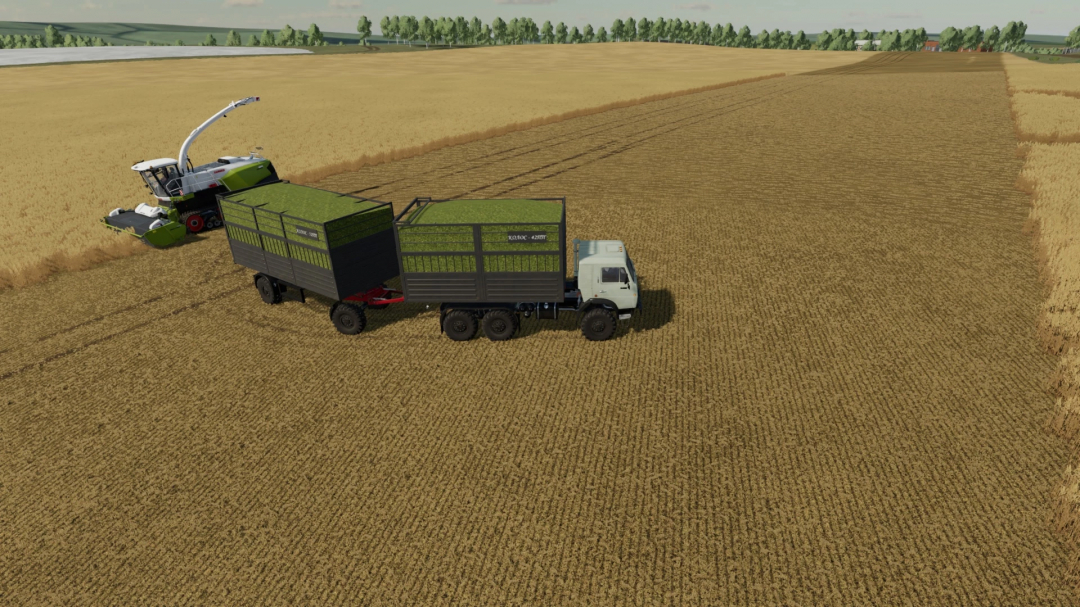 FS22 mod Kolos-52PS/52PP v1.0.0.1 in a wheat field with a harvesting machine and trailer.