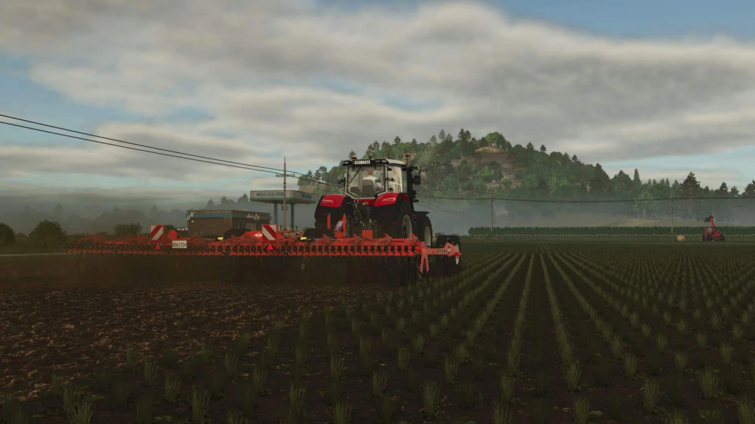 FS25 mod Kuhn Prolander 7500 v1.0.0.0 in action on a farm field, with vibrant landscape in the backdrop.