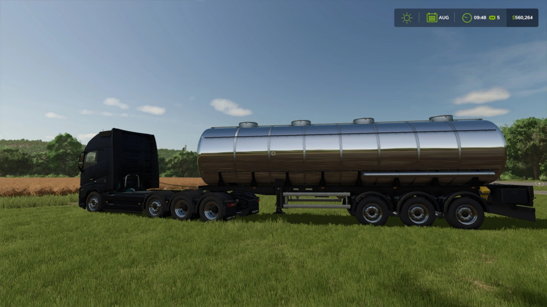 Mks32 Tanker Trailer Edit v1.0.0.0 mod in FS25 shows a silver tanker attached to a black truck, set in a grassy field under a clear sky.