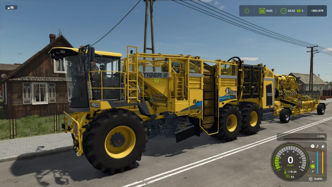 Multifruit ROPA mod for FS25, featuring a yellow harvester on a village street.