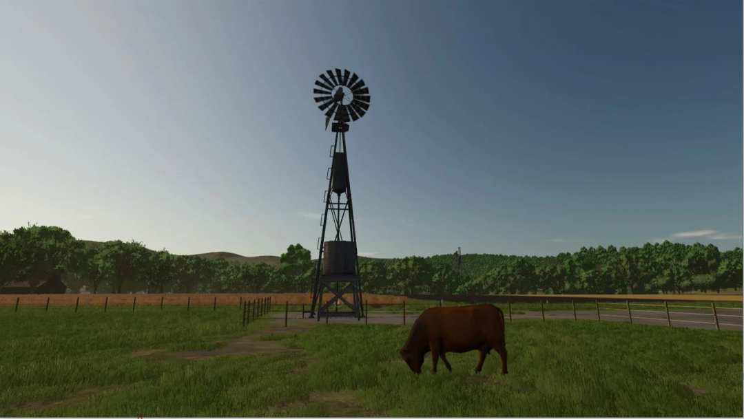 Mod FS25: Stary Wiatrak Darmowa Woda v1.0.0.0 na trawiastym polu z krową, Farming Simulator 25.