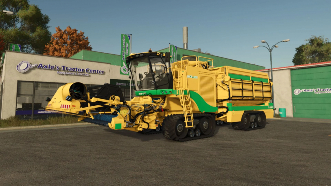 Oxbo Pack v1.0.0.0 mod voor FS25 met een geel-groene oogstmachine bij Axle's Tractor Center.