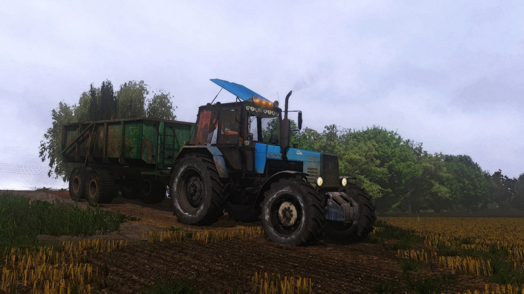 FS22 mod PolGrom BTZ Zeus Pack shows a blue tractor with a green trailer on a farm under cloudy skies.