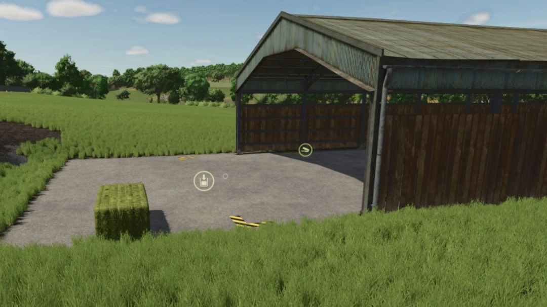 FS25-Mod Storage Shed Autoload v1.0.0.1 mit einer Scheune und einem Heuballen auf einem Feld.