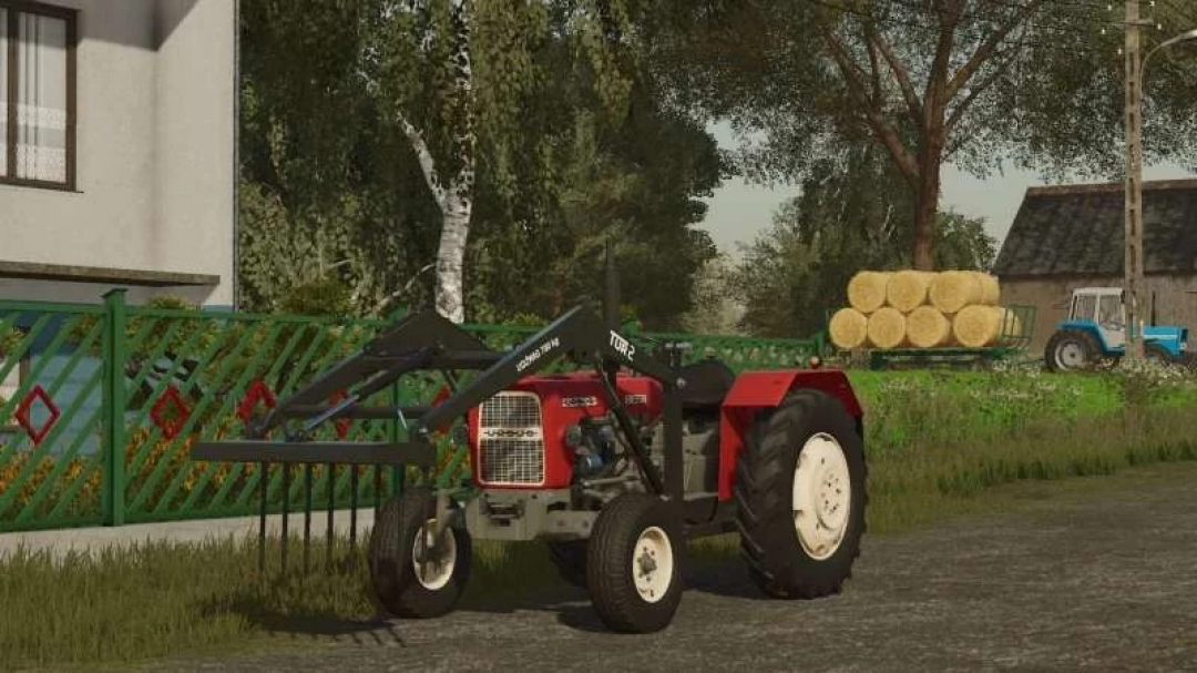 FS22 mods: Ursus C330 tractor with loader on a farm in Farming Simulator 22.